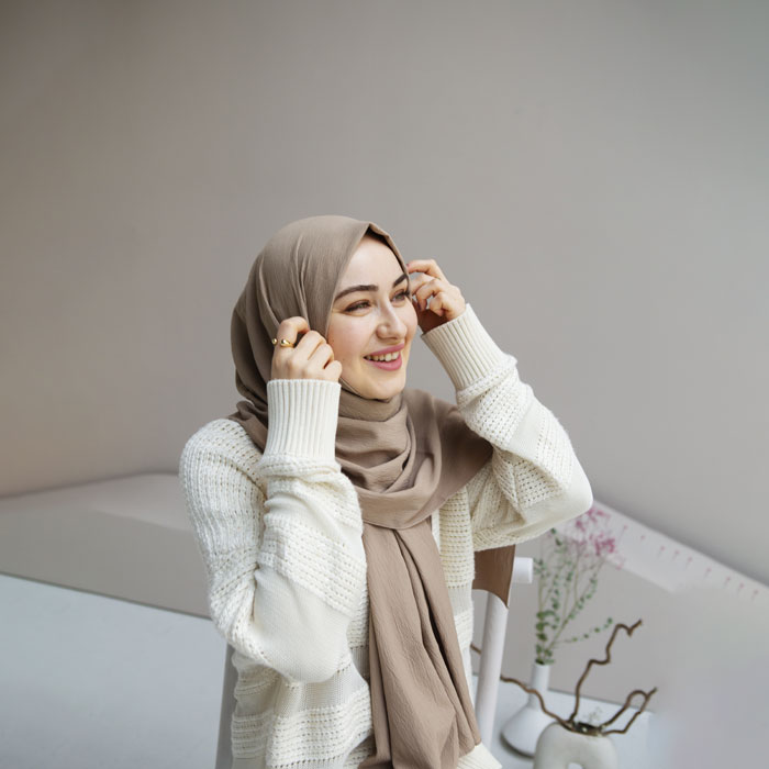 Man looking at phone in a city street