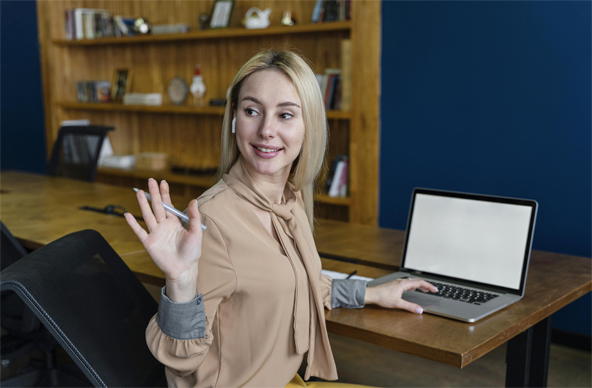 Smiling woman working on a laptop