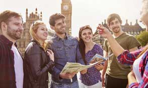Colleagues looking at a sticky-note board