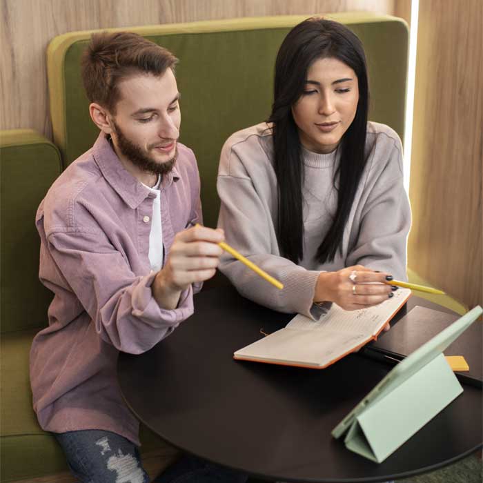 Man looking at phone in a city street