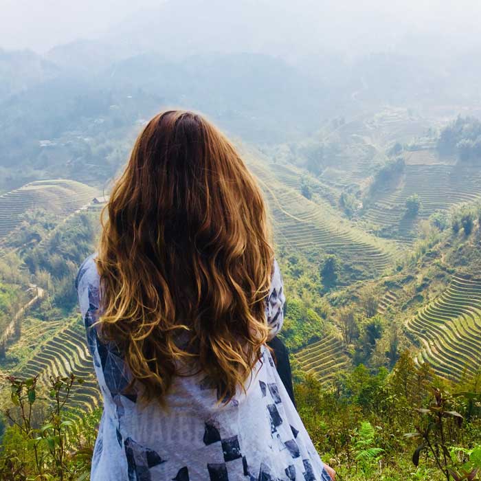 Man looking at phone in a city street