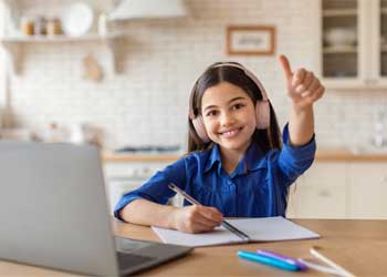 Person studying on a laptop with coffee