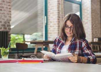 Person studying on a laptop with coffee