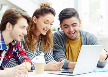 Person studying on a laptop with coffee