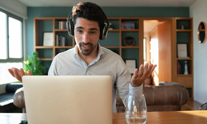 Person studying on a laptop with coffee